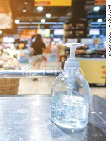 Clear alcohol gel bottles for hand cleaning to prevent the spreading of the corona virus (Covid-19). Place the entrance service for customers before buying in the supermarket. Clear alcohol gel bottles for hand cleaning to prevent the spreading of the corona virus (Covid-19). Place the entrance service for customers before buying in the supermarket. 65031844