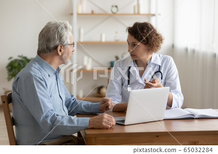 Female professional doctor explaining geriatric disease treatment to senior patient Female professional doctor explaining geriatric disease treatment to senior patient 65032284