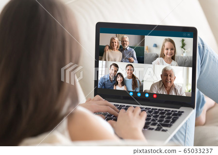 Young female have online video call on laptop with relatives 65033237