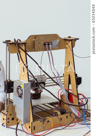 Electronic printer during work in school laboratory, 3D printer, 3D printing. Study and technologies. Electronic printer during work in school laboratory, 3D printer, 3D printing. Study and technologies. 65034848