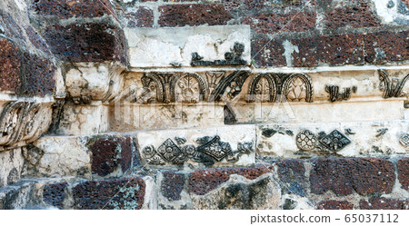 Stone carved ornament as decor at ruin of buddhist Stone carved ornament as decor at ruin of buddhist 65037112