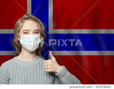 Happy woman in face mask holding thumb up Happy woman in face mask holding thumb up 65038002