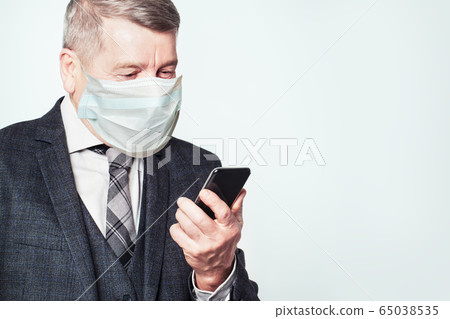 Senior man using smartphoneon white background Senior man using smartphoneon white background 65038535