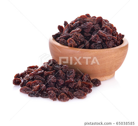 Dried raisins on a white background Dried raisins on a white background 65038585