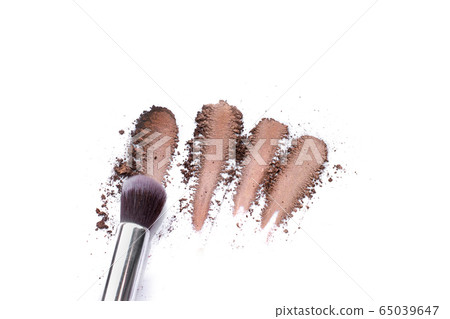 Make up brushes and brown eye shadows on black background. Make up brushes and brown eye shadows on black background. 65039647