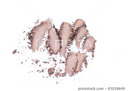 Deep brown crumbled eye shadow isolated on white background.Splatter make up and cosmetic products. Deep brown crumbled eye shadow isolated on white background.Splatter make up and cosmetic products. 65039649
