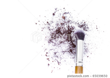 Make up brushes and brown eye shadows on black background. Make up brushes and brown eye shadows on black background. 65039650