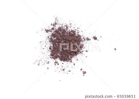 Deep brown crumbled eye shadow isolated on white background.Splatter make up and cosmetic products. 65039651