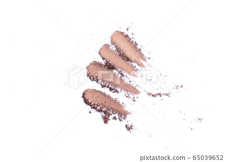 Deep brown crumbled eye shadow isolated on white background.Splatter make up and cosmetic products. Deep brown crumbled eye shadow isolated on white background.Splatter make up and cosmetic products. 65039652