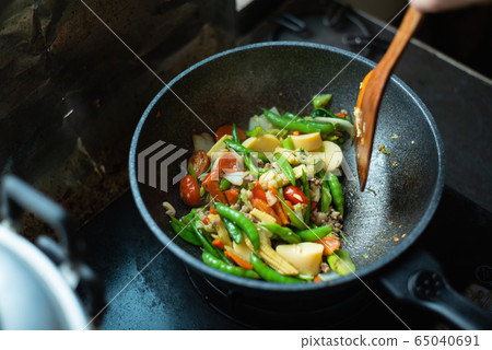 close up fried vegetables  on the pan at the 65040691