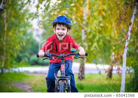 A small white Toddler boy in a protective helmet 65041566
