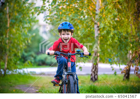 A small white Toddler boy in a protective helmet 65041567
