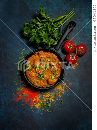 Chicken tikka masala in a pan Chicken tikka masala in a pan 65041802