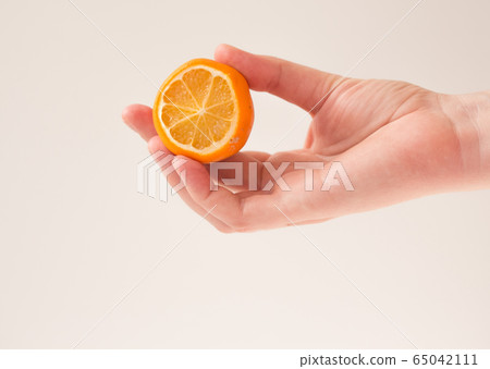 woman holds lemon blank for cosmetic home skin care, spa and natural cosmetics concept. Mockup, copy space woman holds lemon blank for cosmetic home skin care, spa and natural cosmetics concept. Mockup, copy space 65042111