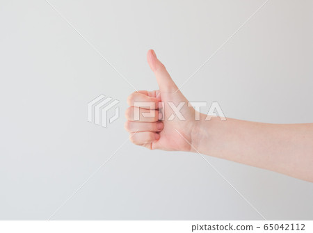 thumb up on a white background with extra space. minimal concept, positive thinking. Card with copy space for text 65042112