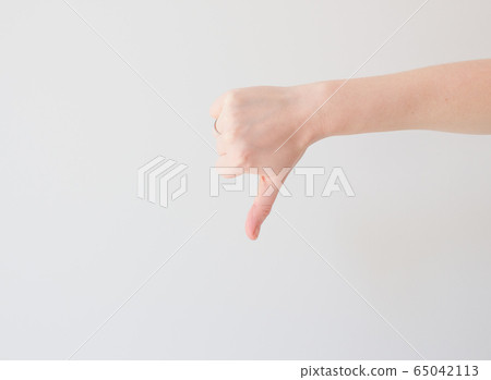thumb down mock up on white background with ext space. minimal concept, negative thinking. Bad result, disappointment 65042113