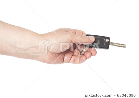 Hand with a car key isolated on white background 65043096