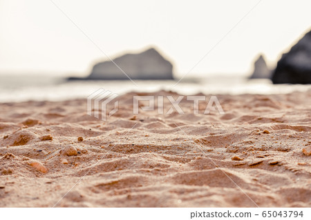 DEtail of sand of Empty beach between cliffs. 65043794