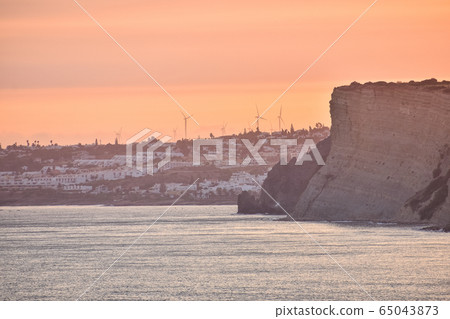 Beautiful sunset over the cliffs of the beach, Beautiful sunset over the cliffs of the beach, 65043873