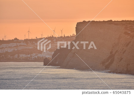 Beautiful sunset over the cliffs of the beach, Beautiful sunset over the cliffs of the beach, 65043875