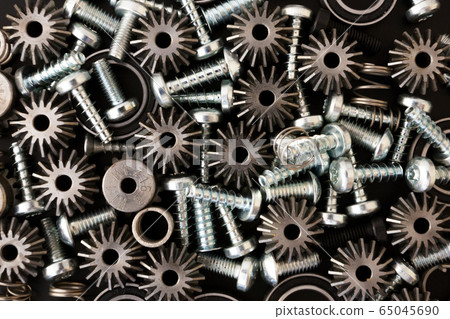 Mechanical components on black background. 65045690