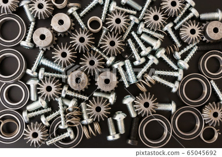 Mechanical components on black background. 65045692