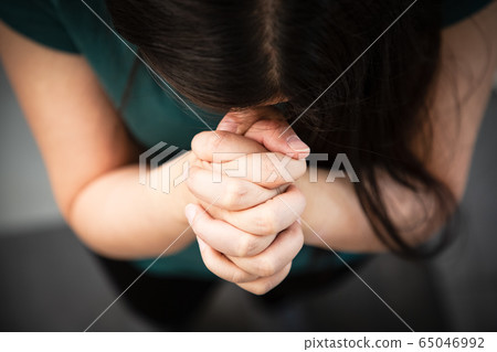 Woman's hand praying and worship to GOD 65046992