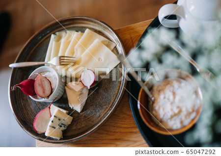 photo of cheese and radish in a plate photo of cheese and radish in a plate 65047292