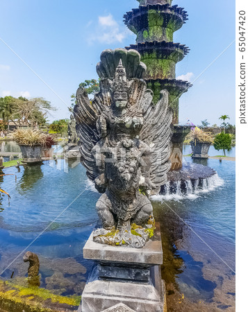 Sculpture at Tirta Gangga Temple in Bali, Sculpture at Tirta Gangga Temple in Bali, 65047420