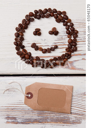 Coffee smile and blank paper tag. Coffee smile and blank paper tag. 65048170