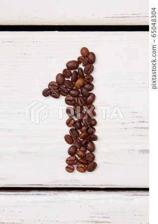 Coffee beans in the form of a number one. 65048304