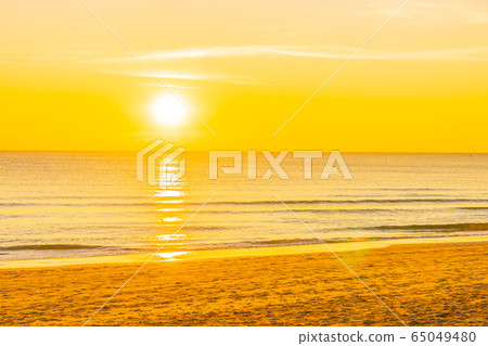 Beautiful tropical nature beach sea ocean at sunset or sunrise Beautiful tropical nature beach sea ocean at sunset or sunrise 65049480