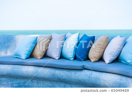 Pillow on chair or sofa lounge around outdoor patio with sea ocean beach view Pillow on chair or sofa lounge around outdoor patio with sea ocean beach view 65049489