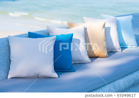 Pillow on chair or sofa lounge around outdoor patio with sea ocean beach view Pillow on chair or sofa lounge around outdoor patio with sea ocean beach view 65049617