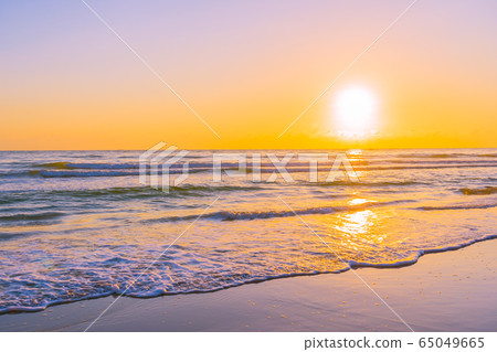 Beautiful tropical beach sea ocean with sunset or sunrise for travel vacation Beautiful tropical beach sea ocean with sunset or sunrise for travel vacation 65049665