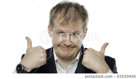 Sleepy drank tired businessman. Disheveled worker in black suit giving thumbs up Sleepy drank tired businessman. Disheveled worker in black suit giving thumbs up 65050409