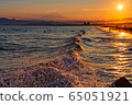View from Kugenuma coast The beautiful sunset on the coastline at sunset as the sun sets, Mt. Fuji, and surfers 65051921