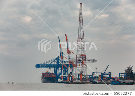 Big ship loading containers by port cranes in Hai Phong container terminal 65052277