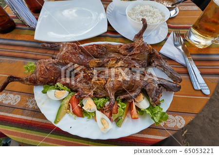 Guinea pig served on a plate Guinea pig served on a plate 65053221
