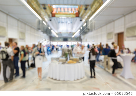 Abstract blurred people socializing during lunch break at business conference. Abstract blurred people socializing during lunch break at business conference. 65053545