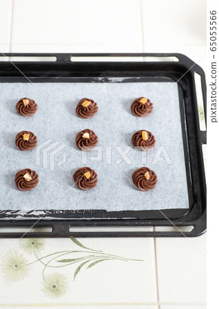 Making sweets at home Ganache cookie Dough on the top plate before baking Making sweets at home Ganache cookie Dough on the top plate before baking 65055566