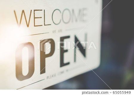 A business sign that says open on cafe or 65055949