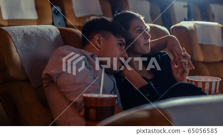 People audience watching movie in cinema theater. People audience watching movie in cinema theater. 65056585