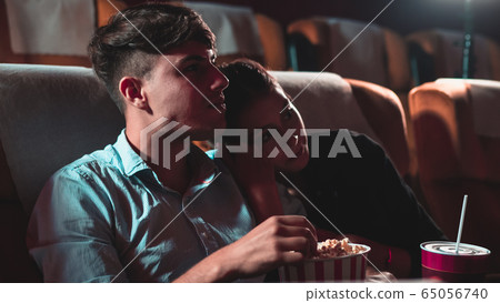 People audience watching movie in cinema theater. 65056740