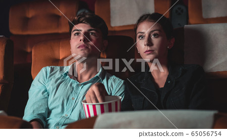 People audience watching movie in cinema theater. 65056754