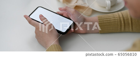 Side view of female freelancer using mock-up Side view of female freelancer using mock-up 65056810