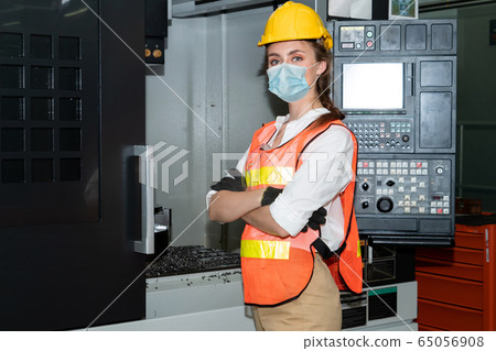 Factory workers with face mask protect from 65056908