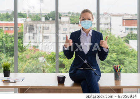 Office worker with face mask quarantine from 65056914
