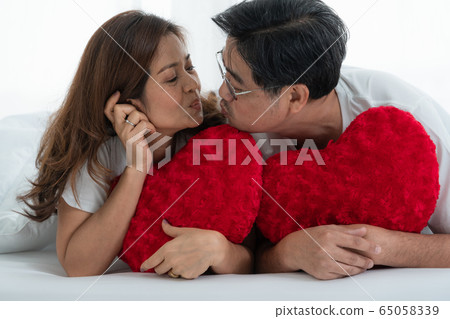 Happy Asian senior people having good time at home 65058339