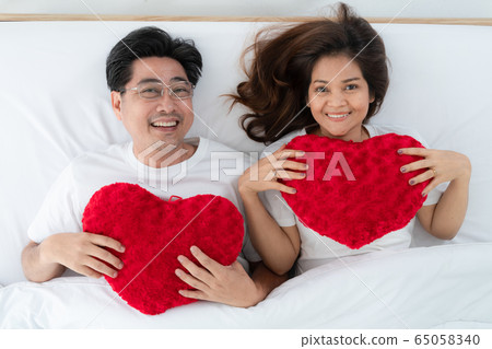 Happy Asian senior people having good time at home 65058340